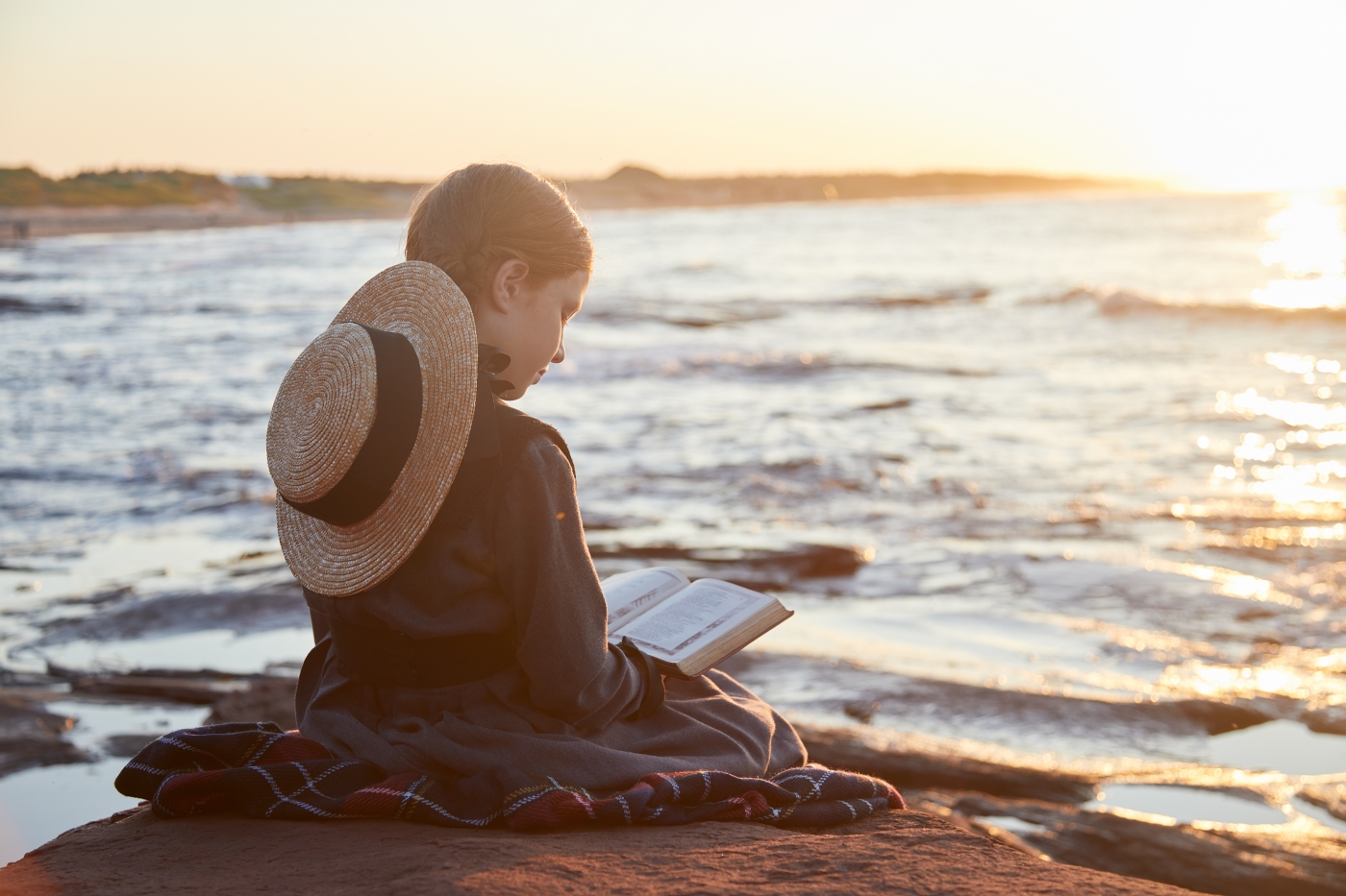 Anne of Green Gables reading on the beach